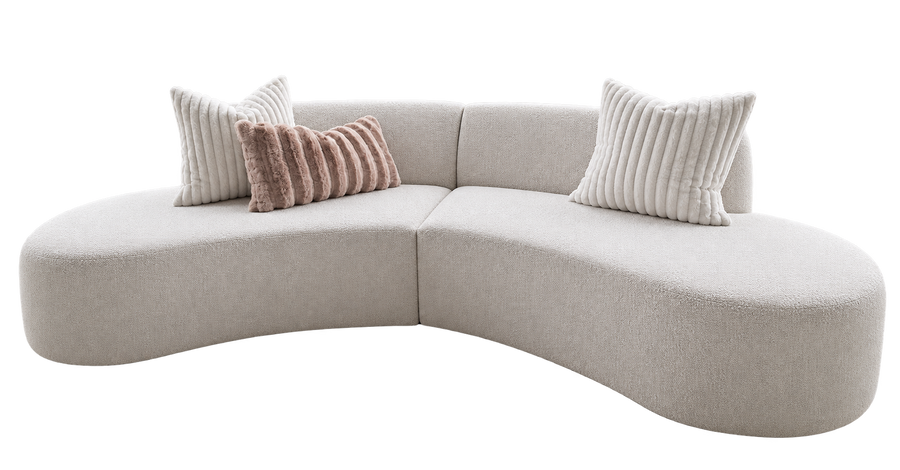 Curved upholstered sofa designed and manufactured by Duvenci Interiors