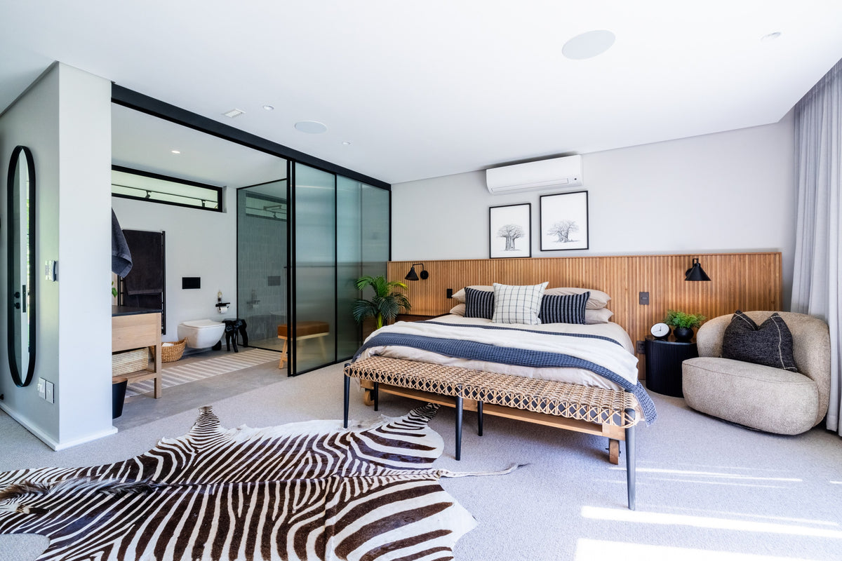 Duvenci Interiors — Bedroom with natural timber and layered textiles